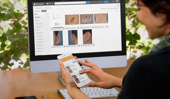 Healthcare professional accessing a DAM system on desktop and mobile to review and organize clinical images.