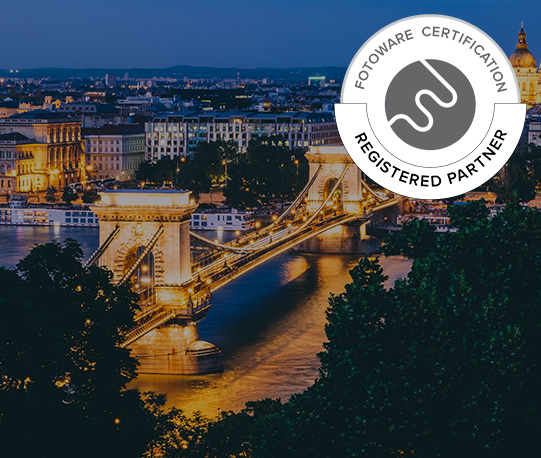 Silicon Computers - Registered partner. Bridge and river in Budapest by night.